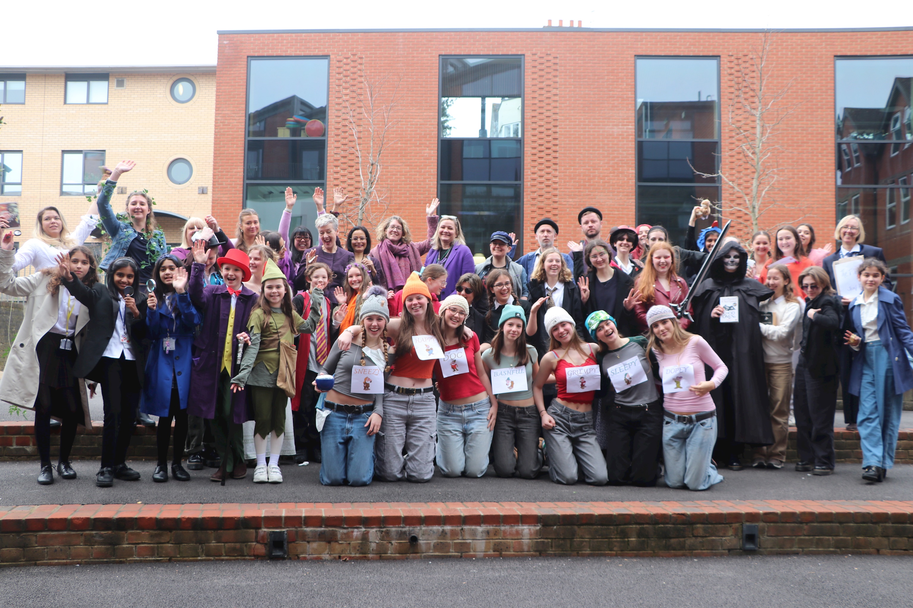 A group photograph of senior school staff and students dressed as book characters for World Book Day