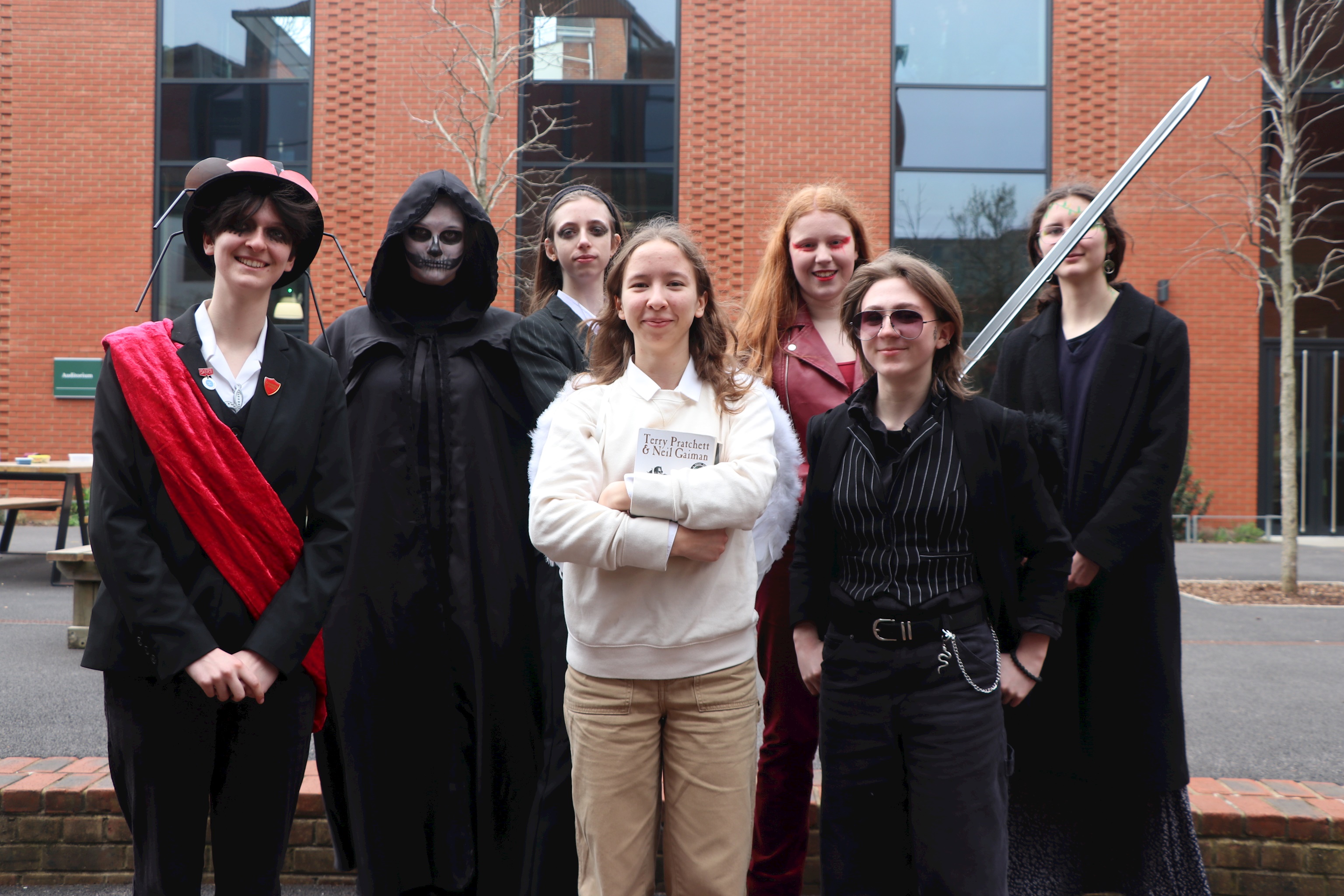 Seven Sixth Form students dressed as characters from the novel 'Good Omens'